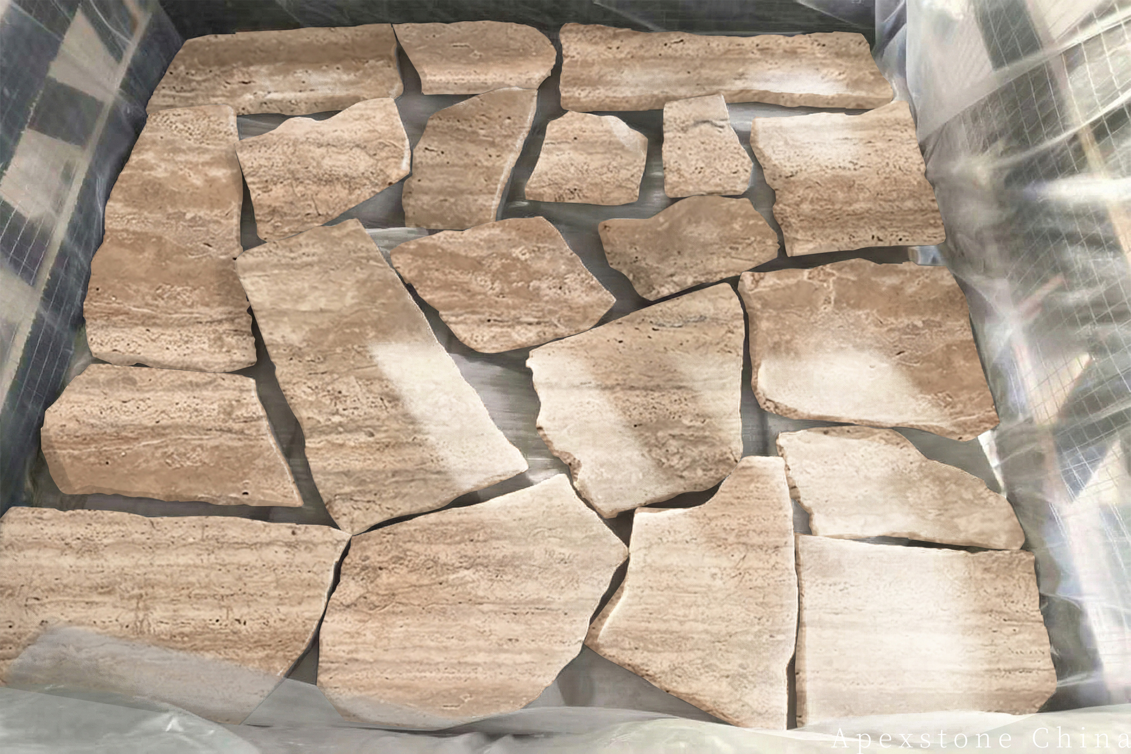 Irregular Travertine Romano pavers dry-arranged before installation