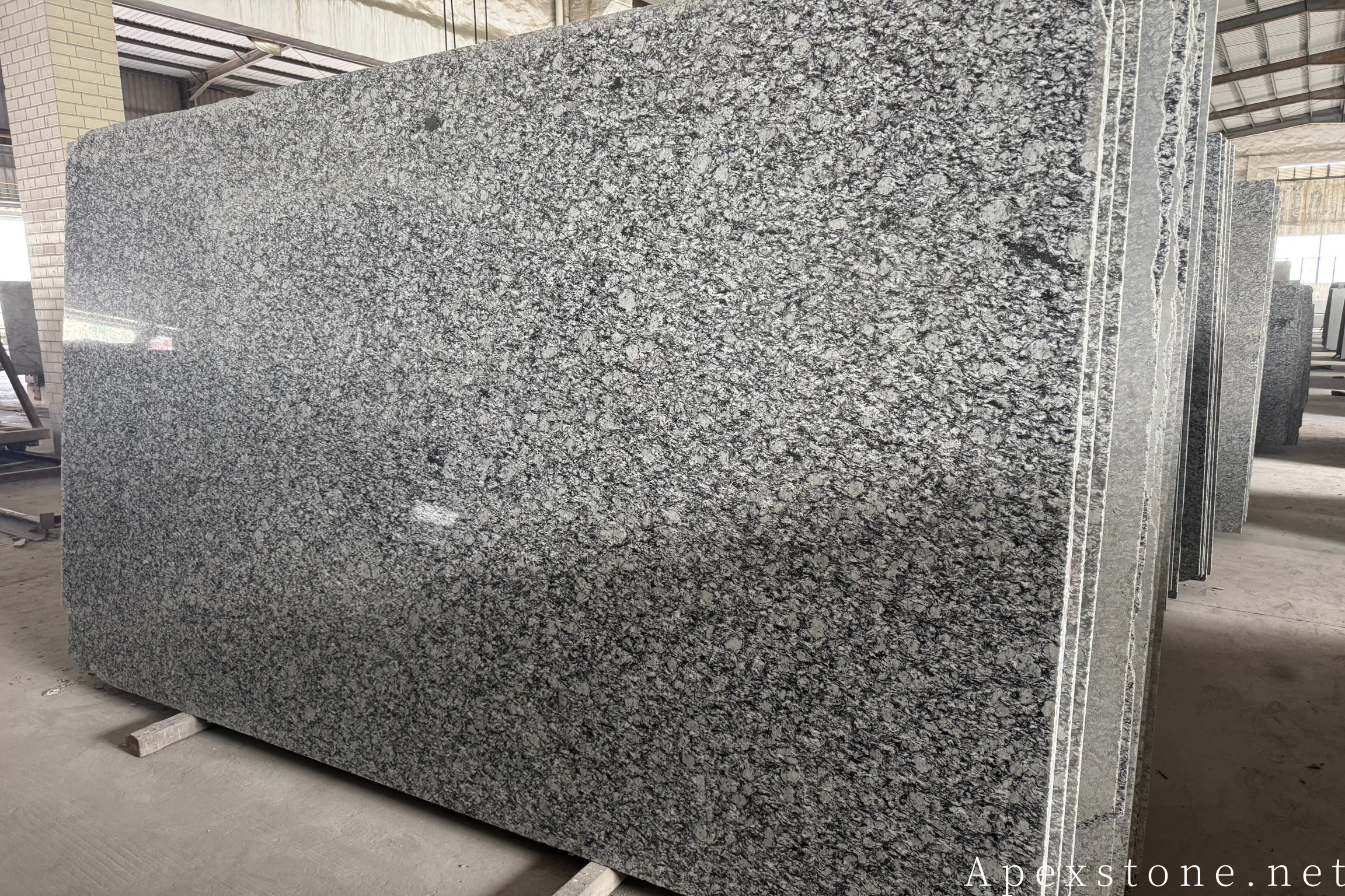 Sea Wave granite garden landscaping slabs laid in an outdoor space