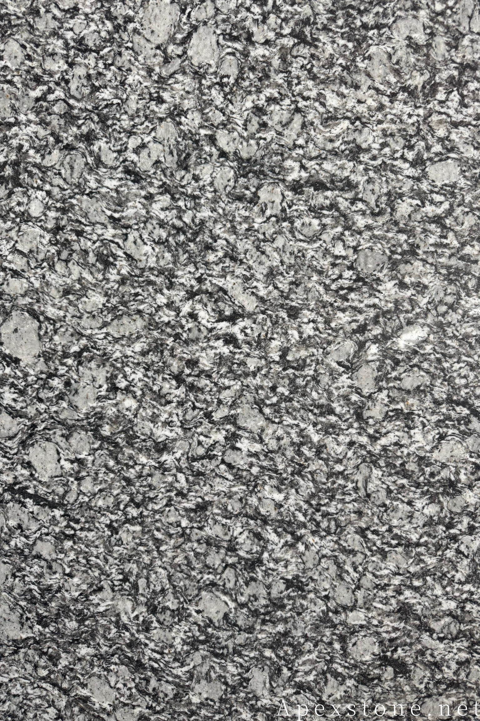 Dark granite slab surface with natural figure, flamed for outdoor paving duty