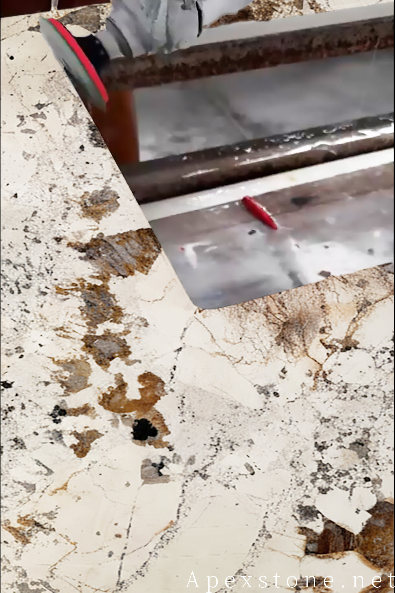 Hand polishing a Pandora quartzite countertop edge