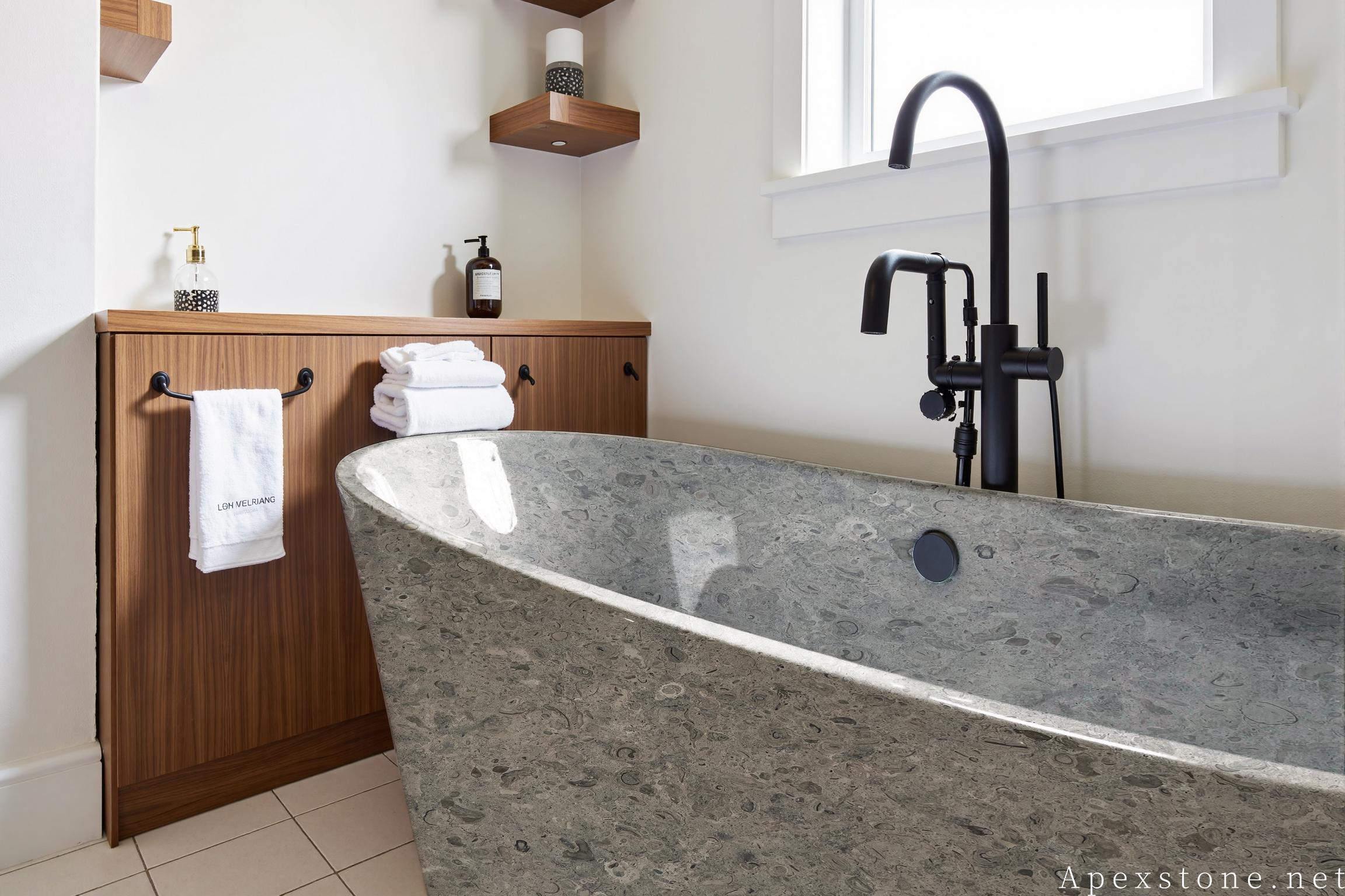 Portuguese Grey limestone freestanding bathtub in a modern bathroom
