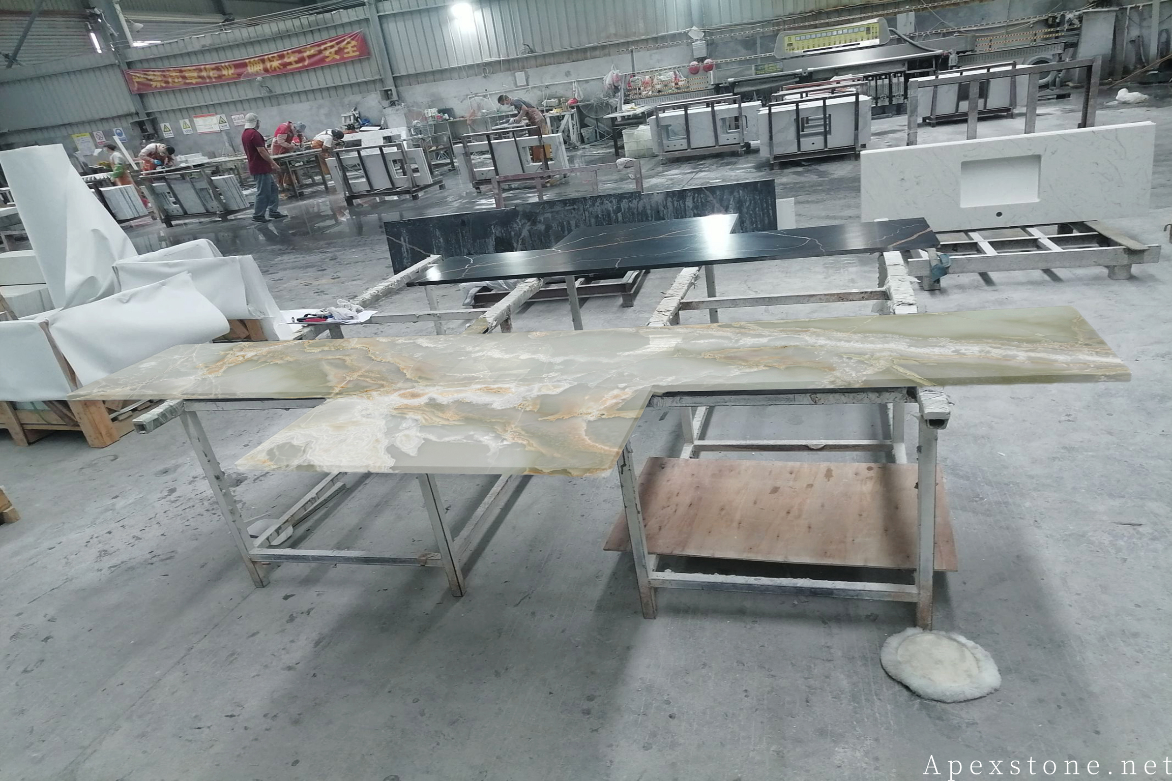 Green Onyx bar top with translucent backlit effect compared with Primavera Marble emerald surface