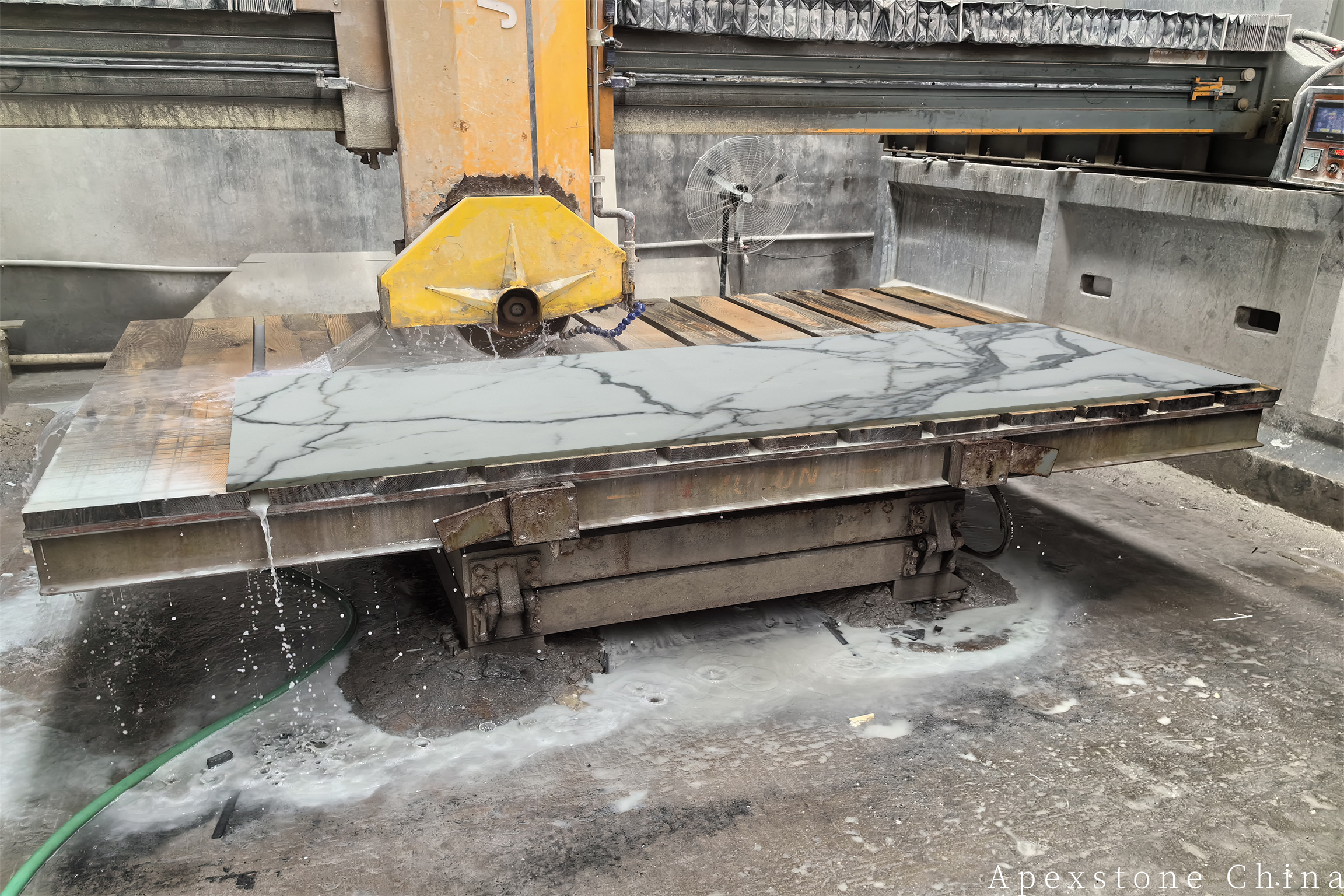 Calacatta White tile cutting on a bridge saw
